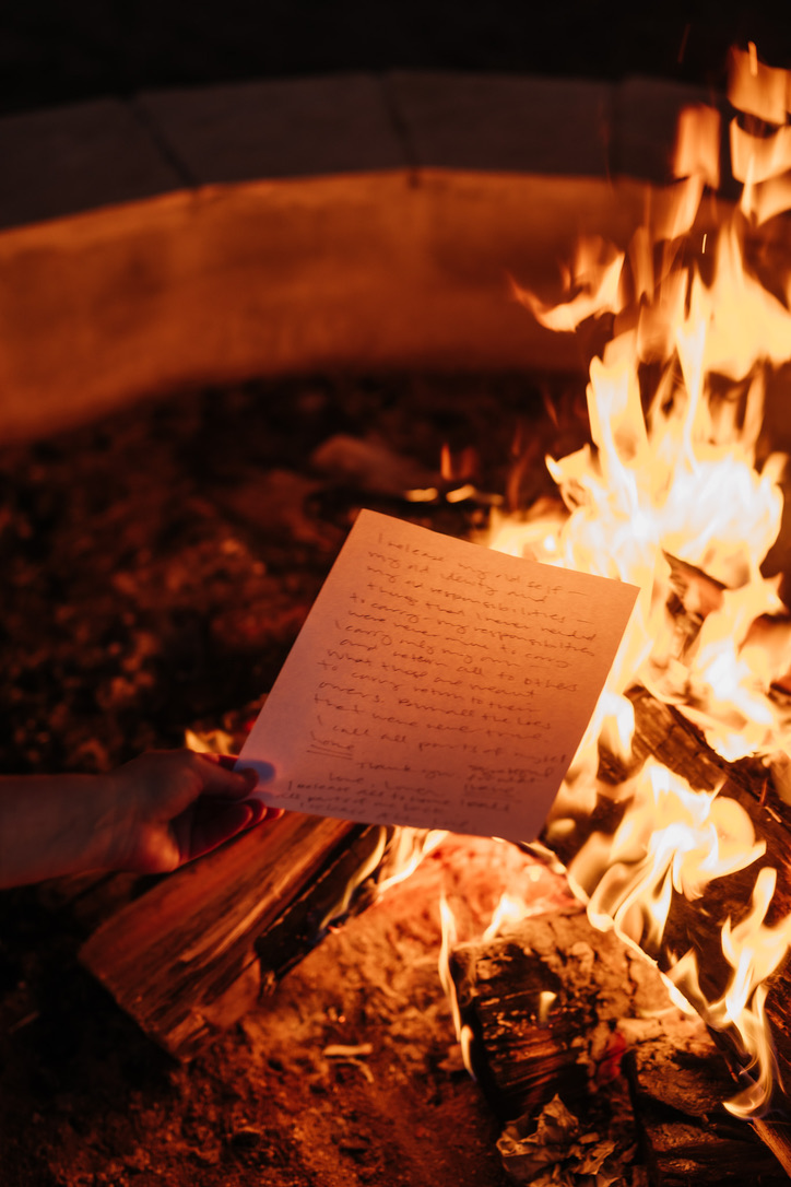 Old beliefs written out and released into the fire