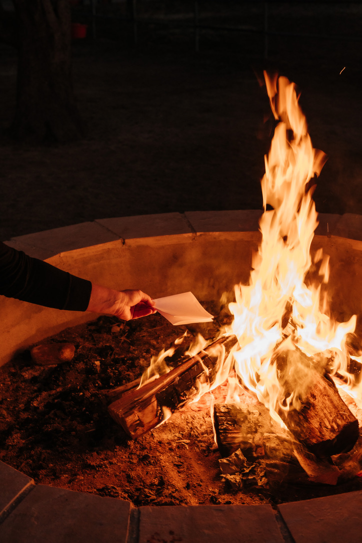 Flames rising in a stone firepit